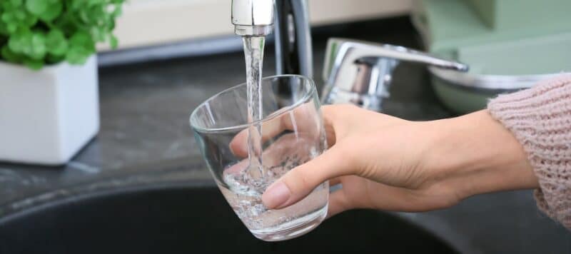 filling a glass with tap water